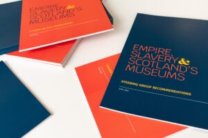 Copies of the Empire, Slavery & Scotland’s Museums Steering Group Recommendations arranged in a pile on a white surface.