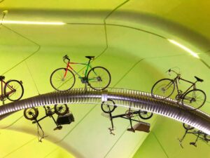Rows of bicycles suspended from the ceiling of the Riverside Museum in Glasgow.