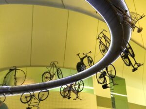 Rows of bicycles suspended from the ceiling of the Riverside Museum in Glasgow.