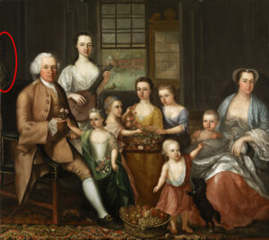 A painting of a family with light skin tone of two adults and seven children are posing for their portrait. They are wearing silk and velvet clothes of long flowing dresses and the man is in a frock coat, waistcoat, and breeches. Barely visible in the background is a child with dark skin tone. A red digitally drawn circle brings attention to them.