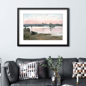 A stylised art print of a coastal harbour scene hangs on a wall above a black leather sofa.